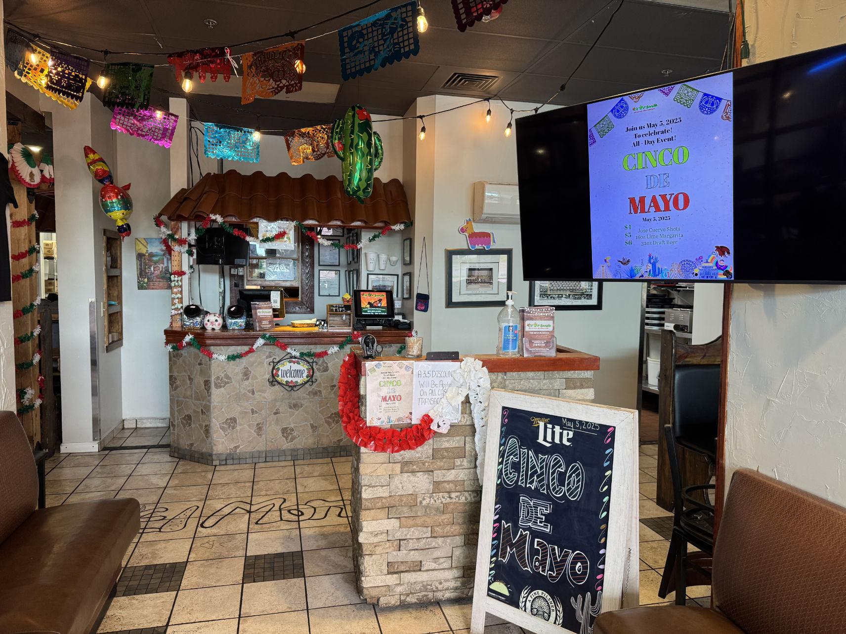 El Monte interior with colorful papel picado banners and string lights ready for trivia night