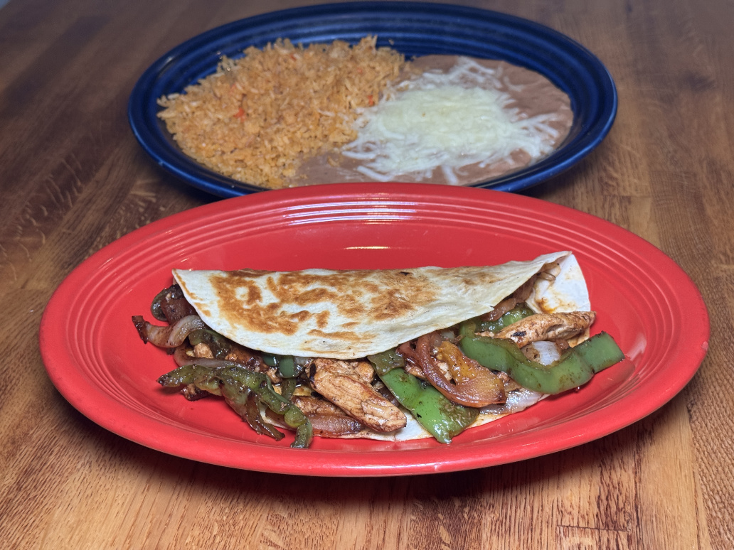 Chicken fajita quesadilla with rice and beans