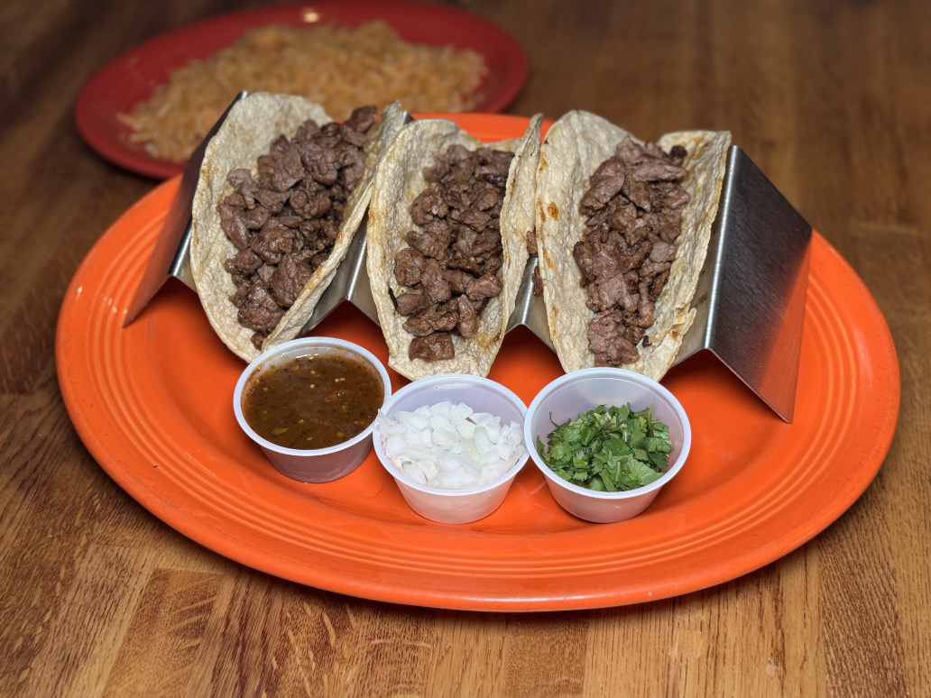 Street-style steak tacos with salsa and cilantro