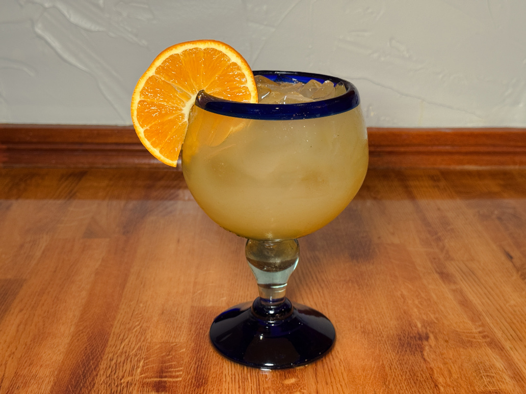 Fresh margarita with orange slice garnish